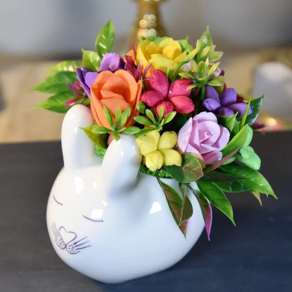 Cute small bunny rabbit planter filled small Sola flowers dyed in bright colors